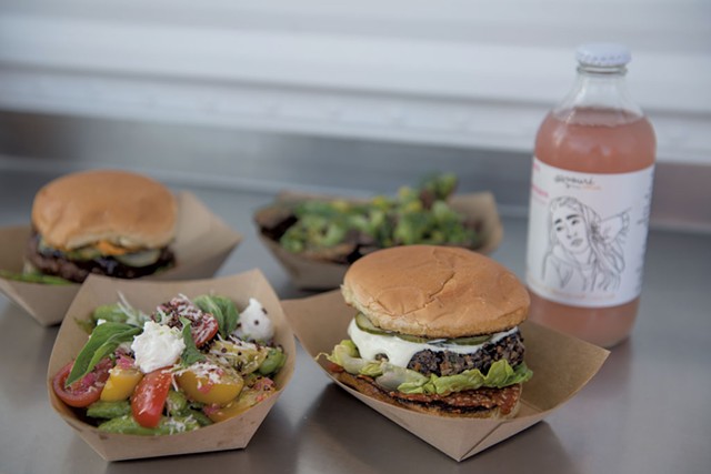 Clockwise from bottom left: Snap pea salad, barbecue falafel burger, crispy potatoes and veggie burger from Mister Foods Fancy - FILE: DARIA BISHOP