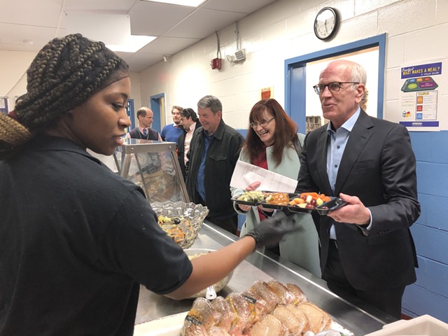 Sen. Peter Welch (right) in the lunch line at St. Albans City School during the listening tour - ANNE WALLACE ALLEN ©️ SEVEN DAYS