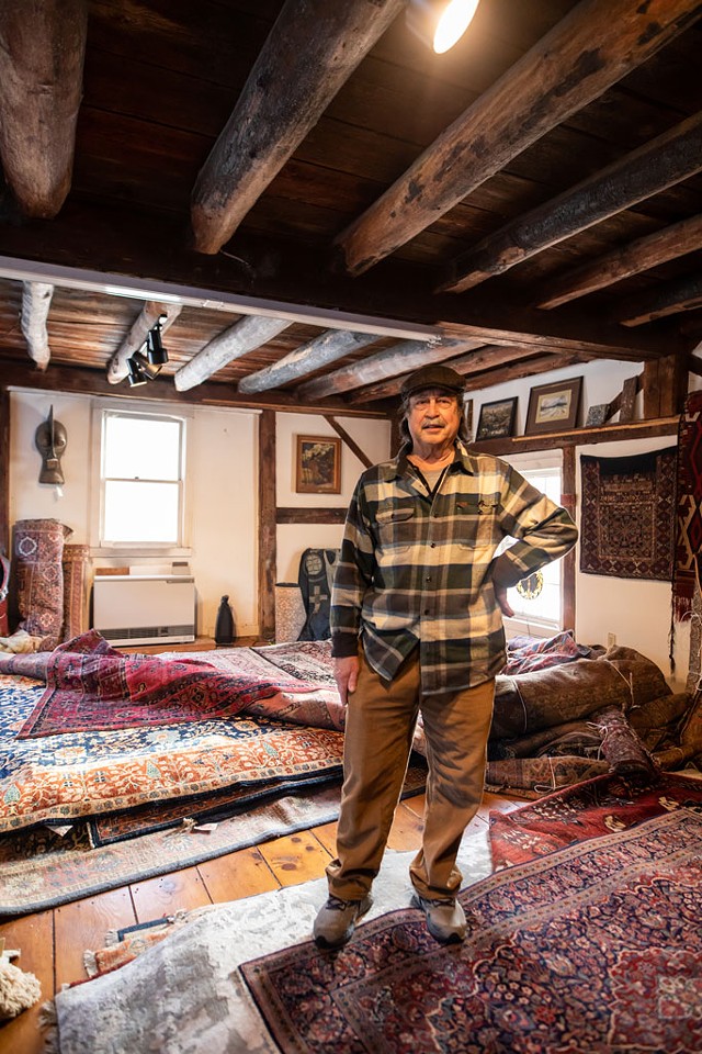 Vince Fernandez of Richmond with his Oriental rugs - LUKE AWTRY