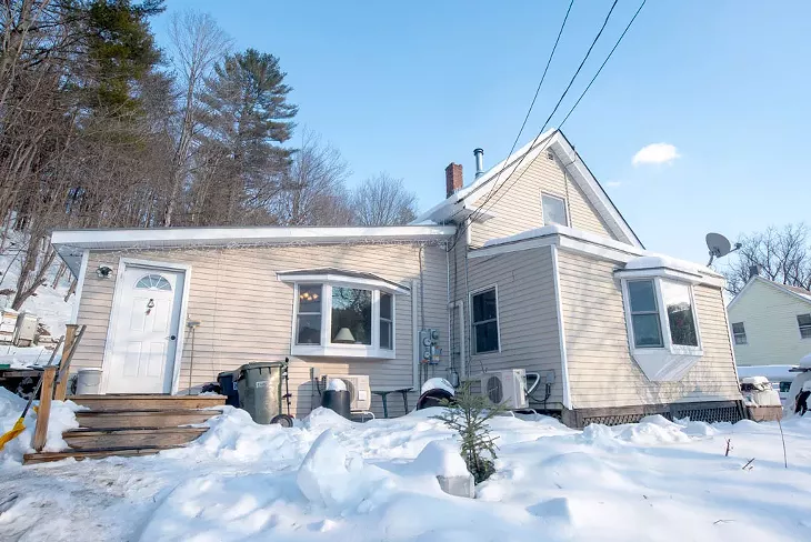 Jean Lowell and her husband live in the single-level addition (left) they built with housing grants. Their daughter and granddaughter live in the main house (right). - JEB WALLACE-BRODEUR