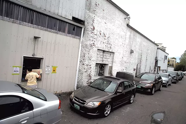 The line at the redemption center at Winooski's Beverage Warehouse - MATTHEW THORSEN