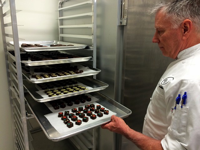 Kevin Toohey with a tray of truffles at Bijou Fine Chocolate - JULIA CLANCY