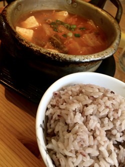 Kimchi jjigae with rice - SUZANNE PODHAIZER
