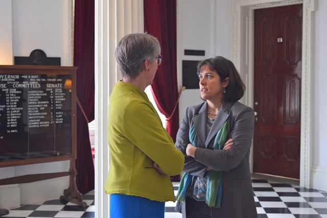 House Speaker Mitzi Johnson confers with Rep. Mary Hooper in the Statehouse hall. - TERRI HALLENBECK