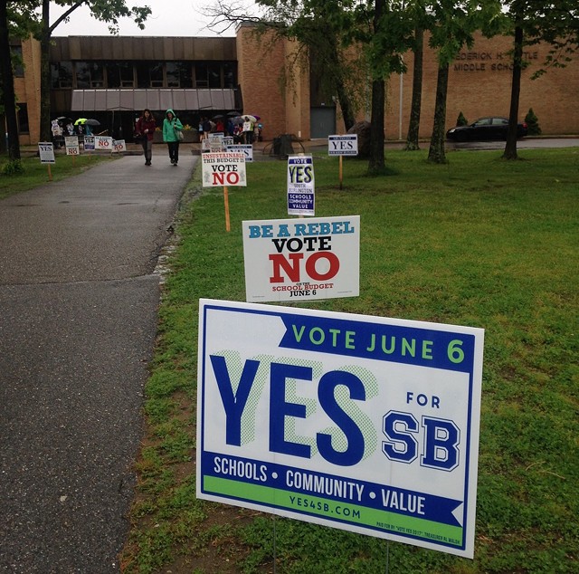 Signs outside Frederick H. Tuttle Middle School in South Burlington Tuesday - MOLLY WALSH