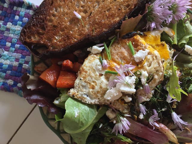 Breakfast salad with egg, radish kimchi, sautéed radishes and greens, and butter-grilled bread - HANNAH PALMER EGAN