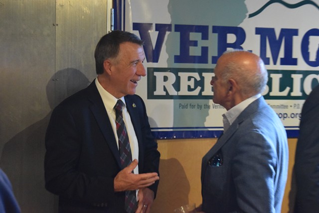 Gov. Phil Scott (left) talking to his former Republican primary rival, Bruce Lisman - TERRI HALLENBECK