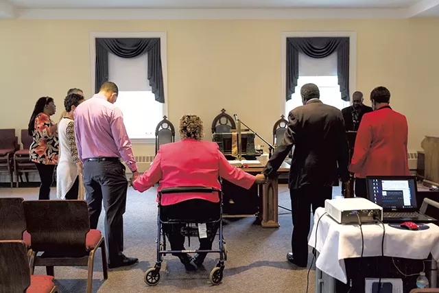 Members of New Alpha gathering around the altar for prayer - OLIVER PARINI