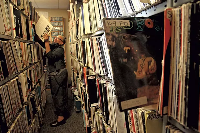 Melo Grant in the record stacks at WRUV - MATTHEW THORSEN