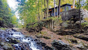 How a Creek-Side Cabin in Waterbury Was Transformed Into an Industrial-Chic Bachelor Pad