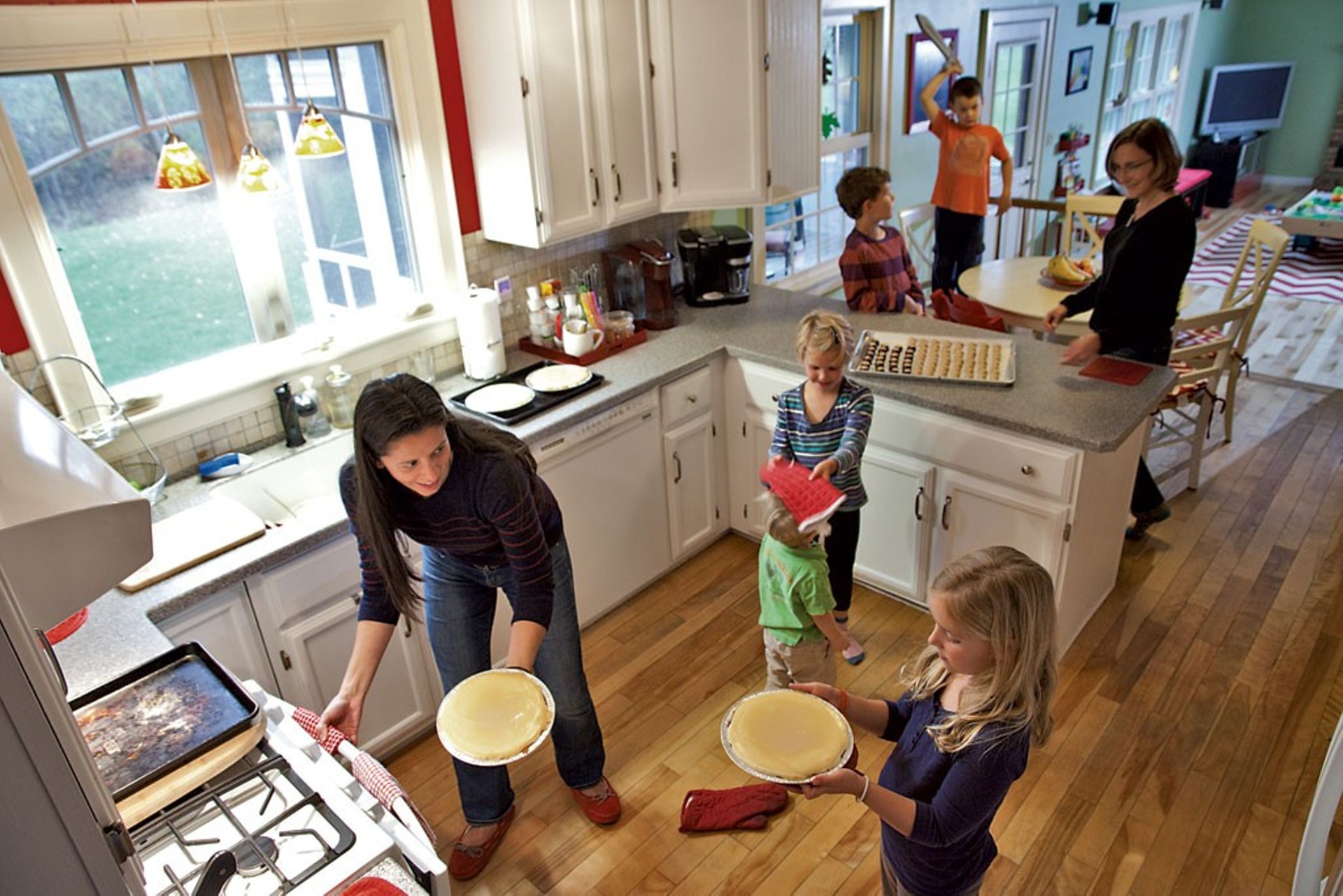 Juanita Galloway in her kitchen with business partner Anne Marcoe and their five kids, (bottom to top) Claire Marcoe, Theo Galloway, Georgia Marcoe, Henry Marcoe and Henry Galloway.