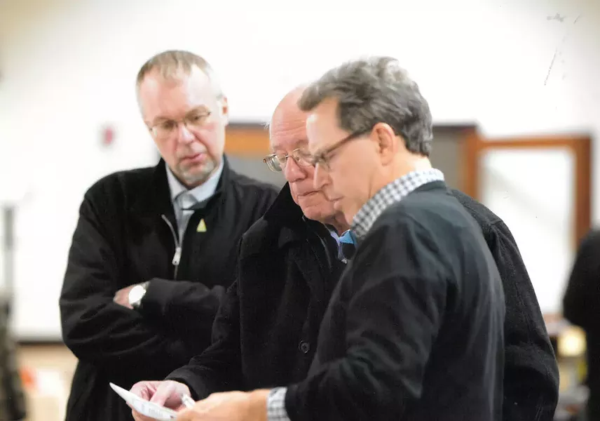 Phil Fiermonte shows Sen. Bernie Sanders and son Levi Sanders results from New Hampshire's February 2016 Democratic presidential primary in Concord, N.H. - COURTESY: PHIL FIERMONTE