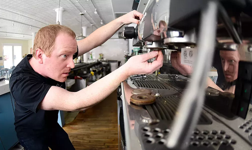 Ben Colley working on an Italian espresso machine at Down Home Kitchen in Montpelier - JEB WALLACE-BRODEUR
