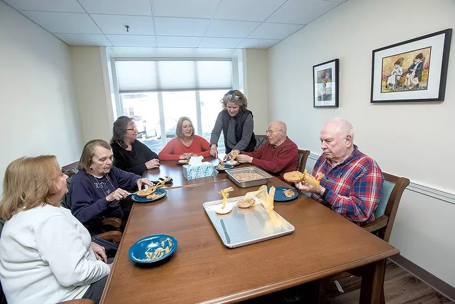 Residents at Memory Care at Allen Brook making bird feeders - COURTESY OF KAREN PIKE