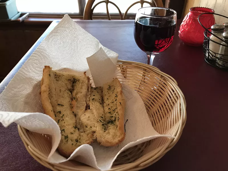 Garlic bread and wine at Papa Frank's - SALLY POLLAK