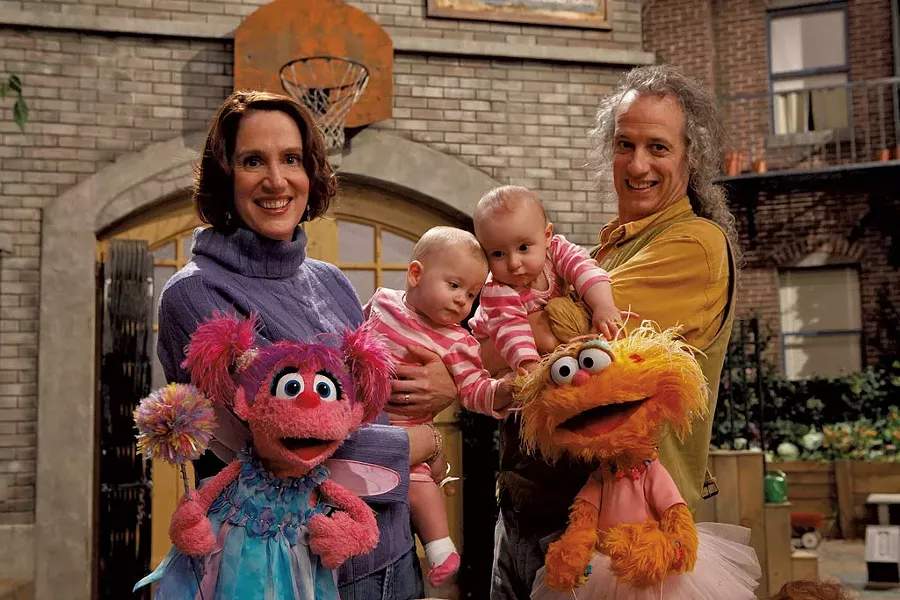 Annie Evans and Martin P. Robinson with their twins and Muppets - COURTESY OF "SESAME STREET"