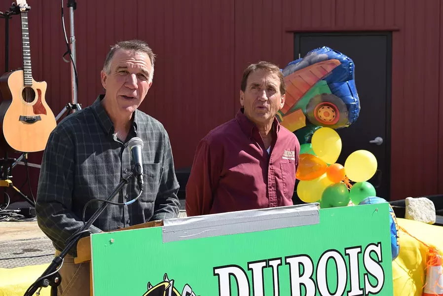 Republican gubernatorial candidate Phil Scott (left) announces he will sell his share in DuBois Construction if he’s elected governor, as co-owner Don DuBois looks on Saturday outside the company's Middlesex offices. - TERRI HALLENBECK