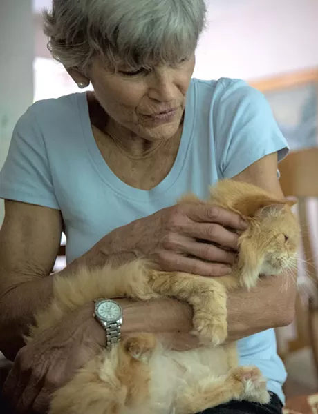 Annie Viets holding one of her rescue cats - JAMES BUCK