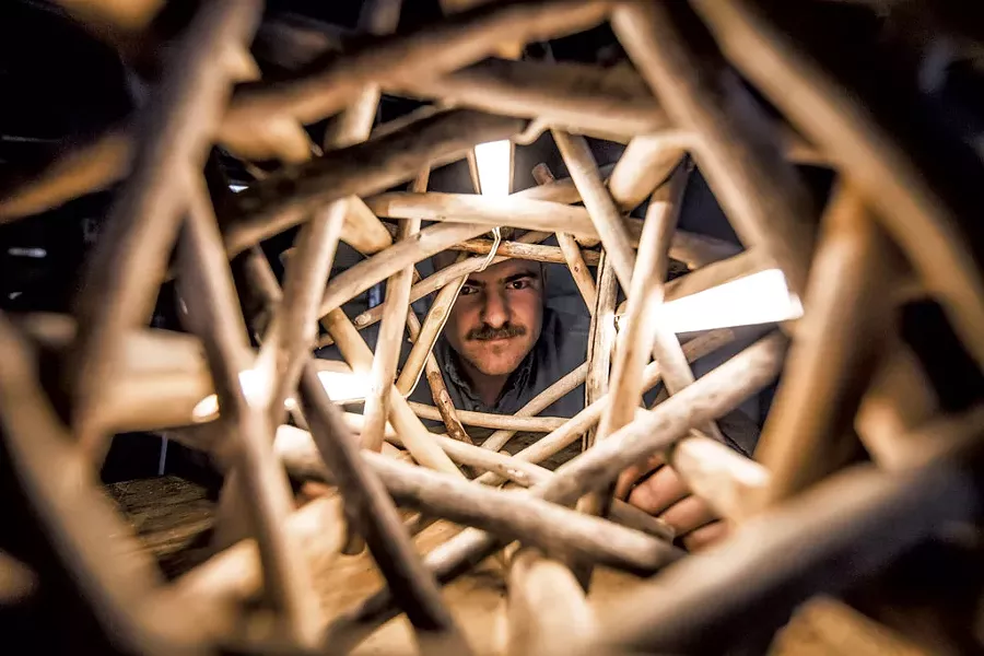 Clay Mohrman with one of his sculptural driftwood lamps - LUKE AWTRY