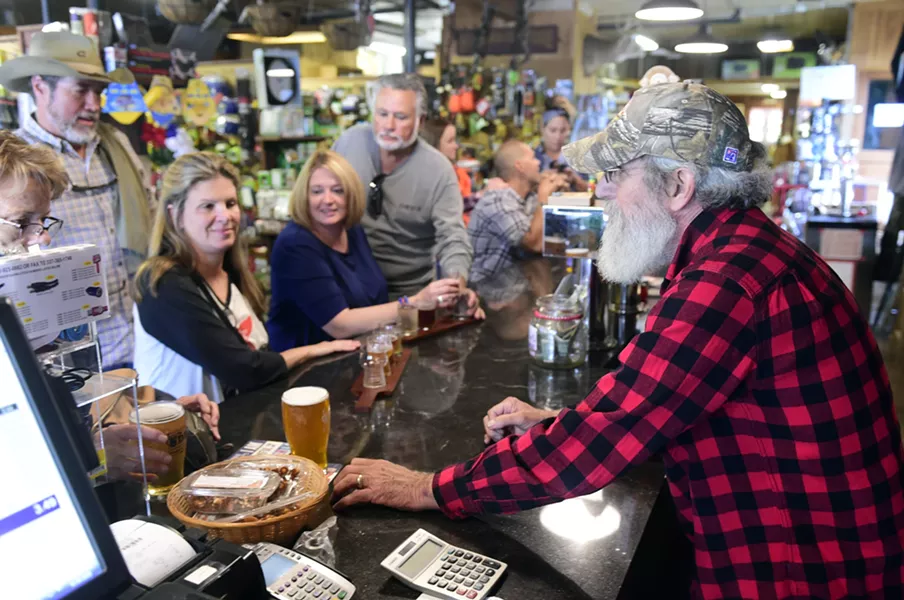 Dale Brown serving up some brews at the Den at Harry's Hardware, Cabot - JEB WALLACE-BRODEUR