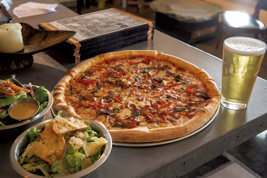Hunter pizza with glazed pork belly, charred peppers, grilled onions and fresh rosemary - JAMES BUCK