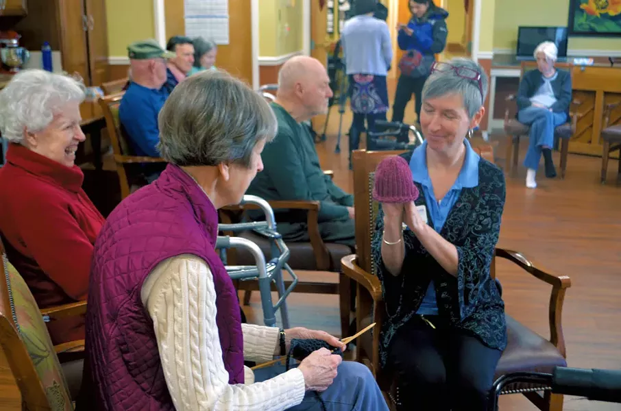 Jenn Ross (right) holding up a sample hat for Maggie Ross - KATIE JICKLING