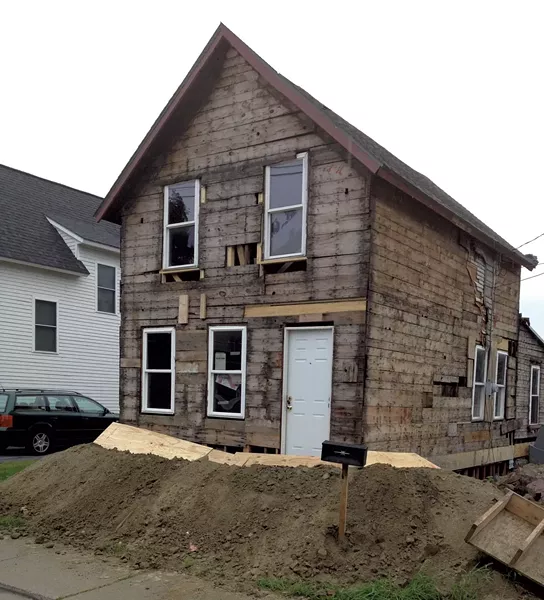 August 2014: The house is stripped back to the frame and jacked up to allow work on the basement foundation. - COURTESY OF GRAHAM MACHARG