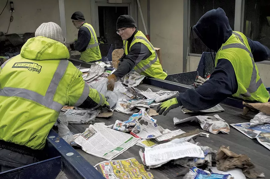 Workers sorting recycling - CALEB KENNA