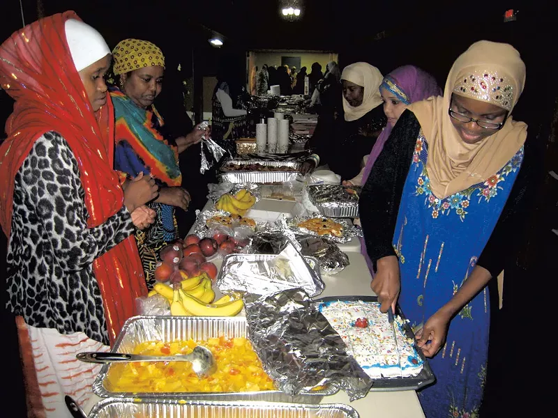 Hawa Adam (right), organizer Luley Amir (second from left) and other iftar attendees - KYMELYA SARI