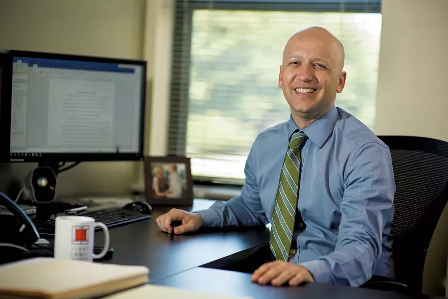 Brian Stark at his office in South Burlington - COURTESY OF ANDY DUBACK