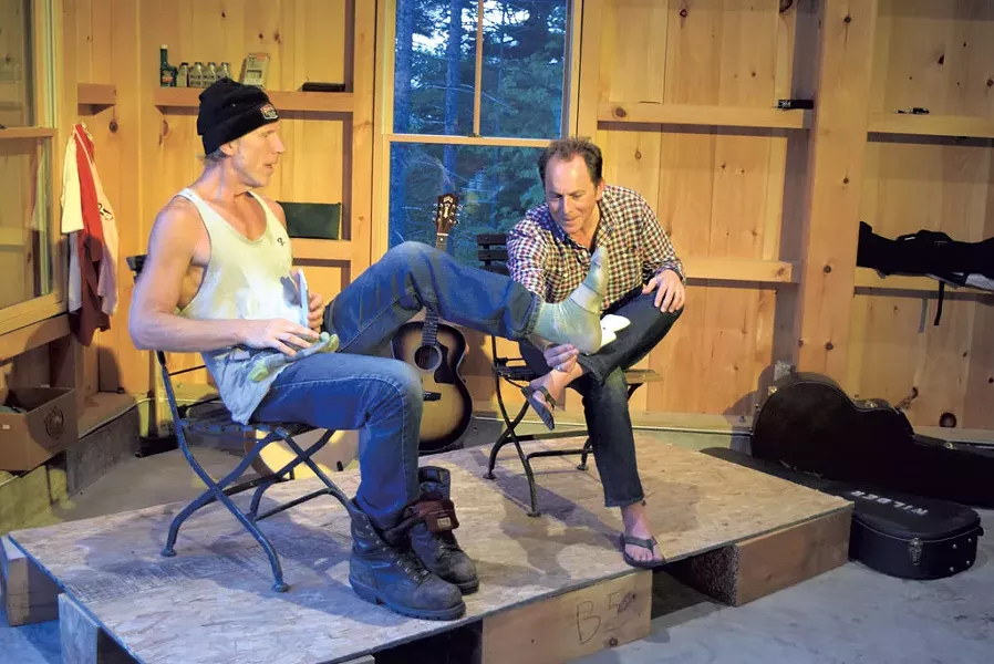 Rusty DeWees shows Ric Cabot his Darn Tough sock - TERRI HALLENBECK