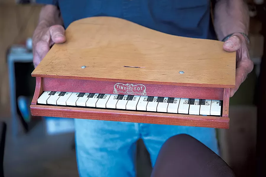 Jack Brown holds a toy piano - CALEB KENNA