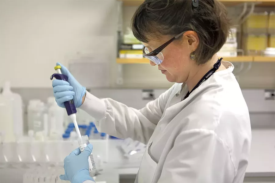 The Vermont Department of Health's Ali Boren performing a lead test on a water sample taken from a childcare center - KEVIN MCCALLUM