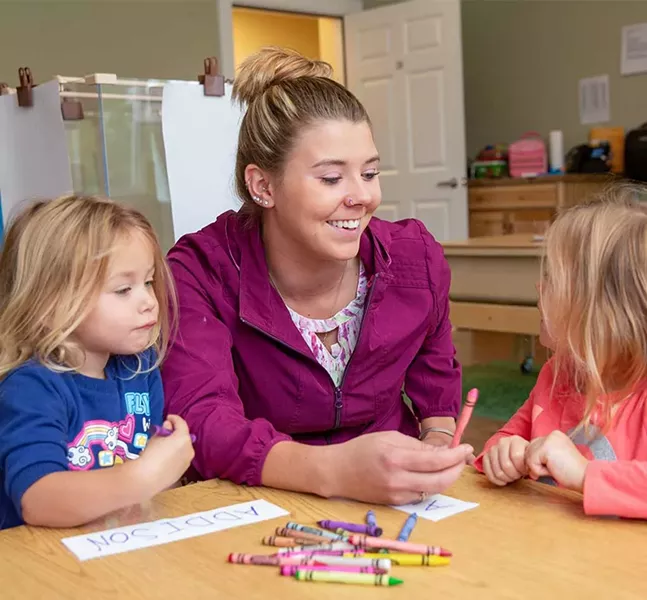 Brianna Hawksworth spending a few minutes with her daughters, Addison and Aubree, before leaving for work - WAYNE TARR