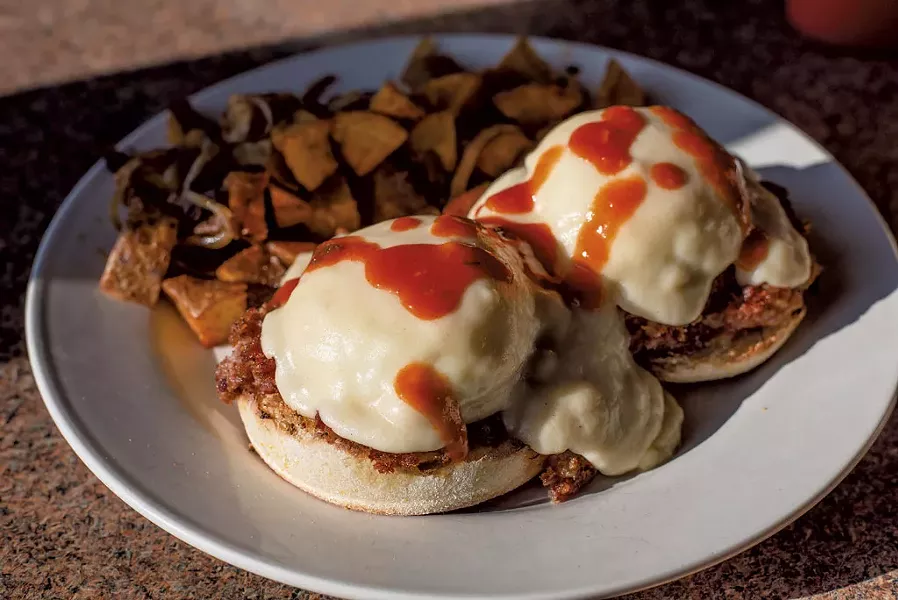 Biscuits and gravy with poached eggs at the Family Table - GLENN RUSSELL