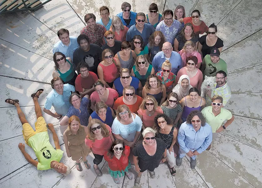 STAFF PHOTO, 2015: Clockwise from bottom left: Matthew Thorsen (lying down), Megan James (on shirt), Michael Bradshaw, Margot Harrison, Aaron Shrewsbury, Jeff Baron, Mark Davis, Nicole DeSmet, Hannah Palmer Egan, Brooke Bousquet, Eva Sollberger, Kirsten Cheney, Matt Weiner, Paul Heintz (on shirt), John James, Rufus, Don Eggert, Colby Roberts, Paula Routly, Diane Sullivan, Alice Levitt, Terri Hallenbeck, Andrea Suozzo, Cathy Resmer, Neel Tandan, Bobby Hackney Jr., Meredith Coeyman (on shirt), Dan Bolles, Nancy Remsen, Ken Picard, Ethan de Seife, Lisa Matanle, Molly Walsh, Pamela Polston, Kymelya Sari, Marisa Keller, Carolyn Fox, Michelle Brown, Robyn Birgisson, Alison Novak, Kaitlin Montgomery, Logan Pintka, Alicia Freese, Kristen Hutter, Cheryl Brownell, Matthew Roy, Kristen Ravin, Nicole Christopher, Ashley Cleare, Julia Atherton, Corey Grenier. Absent: Brett Stanciu, Diana Todisco. (Photo: Matthew Thorsen)