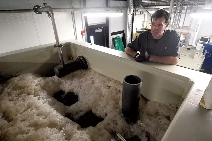 Steve Miller observing one of the Alchemist's on-site wastewater treatment tanks in Stowe - JEB WALLACE-BRODEUR