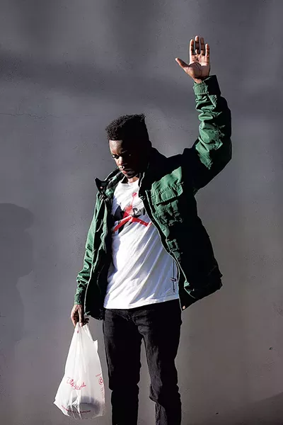 "Jordan Raising His Hand (Encounter)" by John Edmonds - COURTESY OF FLEMING MUSEUM OF ART/LIGHT WORK