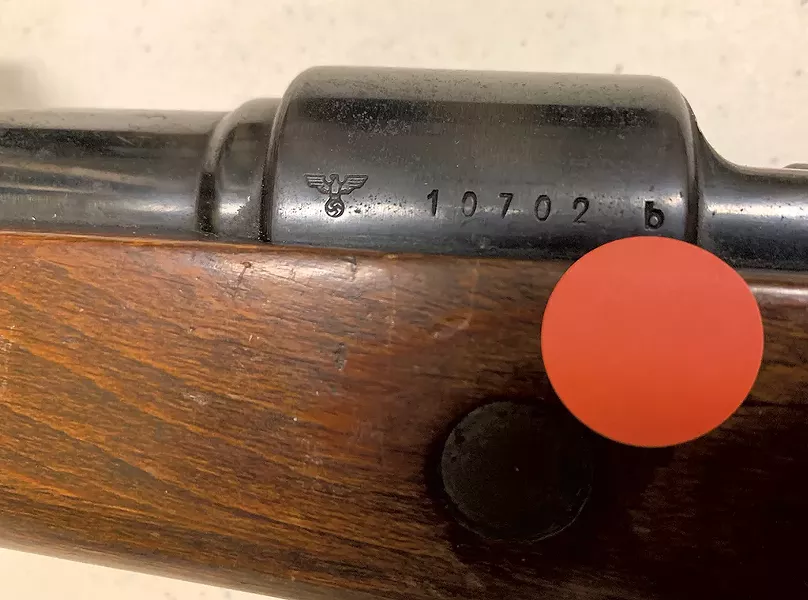 The Nazi Reichsadler emblem on a rifle that the state is selling - PAUL HEINTZ