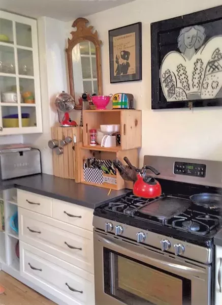 Stacked crates offer additional countertop shelving. - COURTESY OF LIZA COWAN