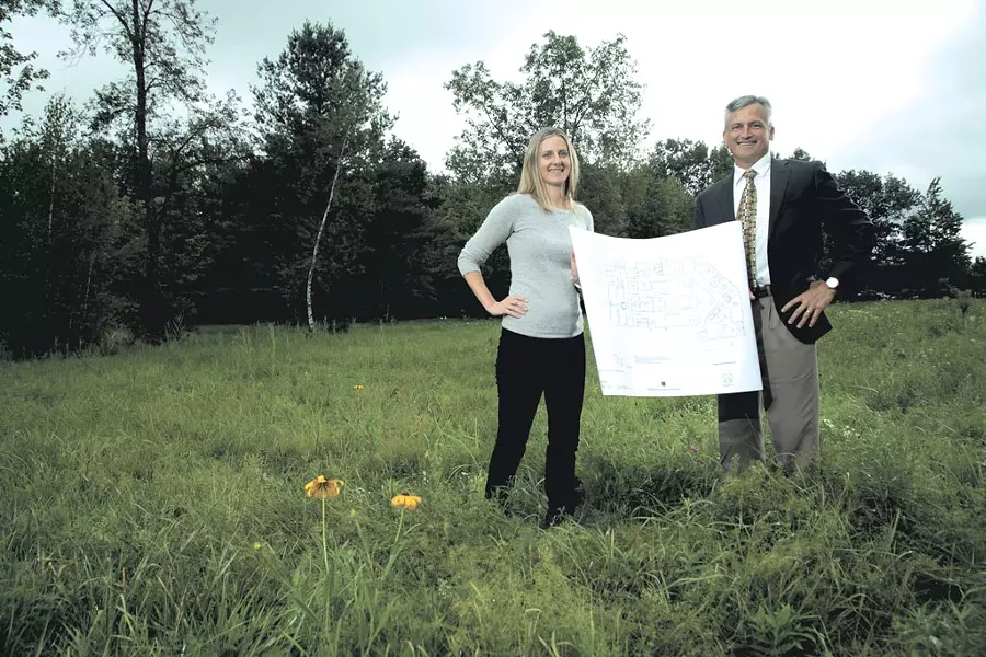 Amy Cooper and Dr. Tom Dowhan at the site of the proposed surgical center - MATTHEW THORSEN