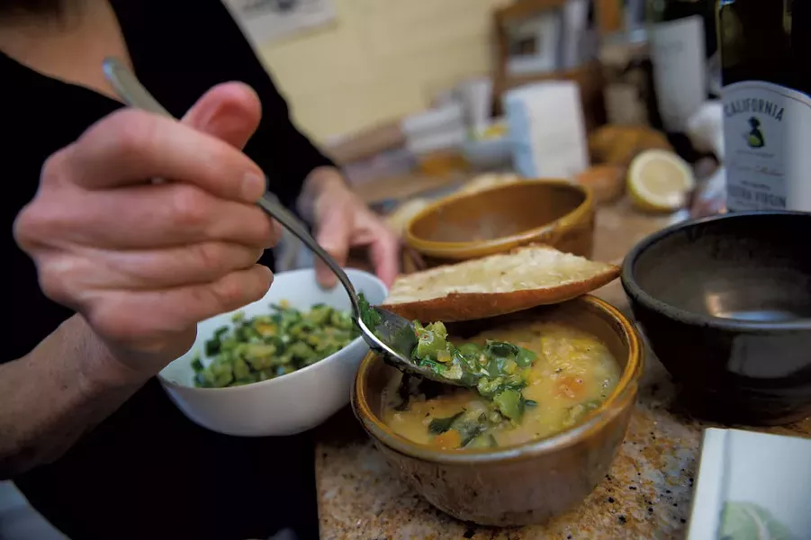 Molly Stevens dishing out a vegetable-and-lentil soup - DARIA BISHOP