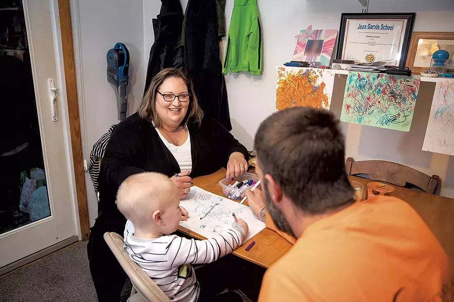 Ashley Messier with her youngest son and husband - JAMES BUCK