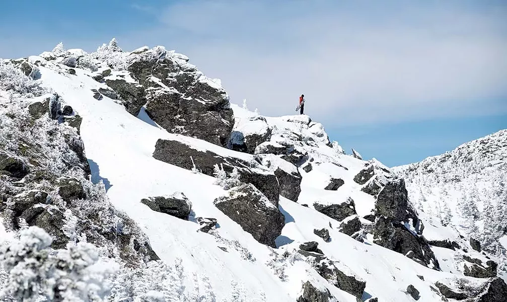 A snowboarder on the ridgeline of Mount Mansfield - NATHANAEL ASARO