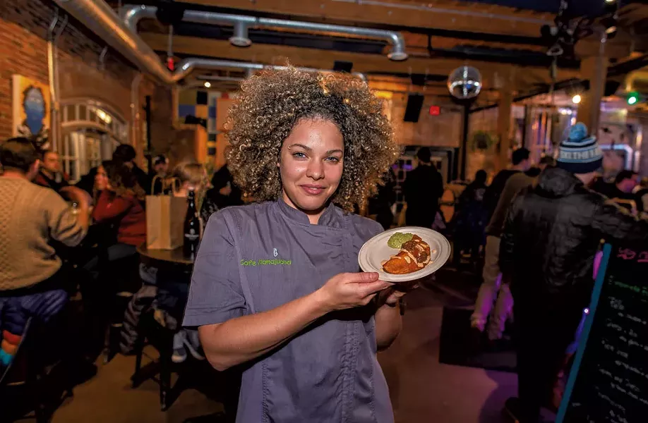 Maria Lara-Bregatta with a pollo empanada - GLENN RUSSELL