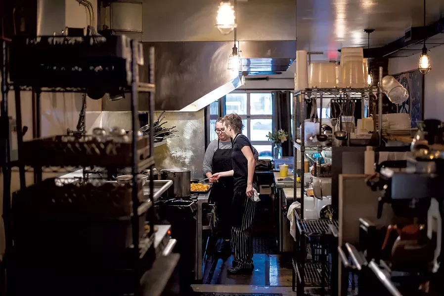 Chef/co-owner Debra Maisel (left) and sous chef Jaqueline de Achaval preparing Buffalo cauliflower tacos at Revolution Kitchen - GLENN RUSSELL