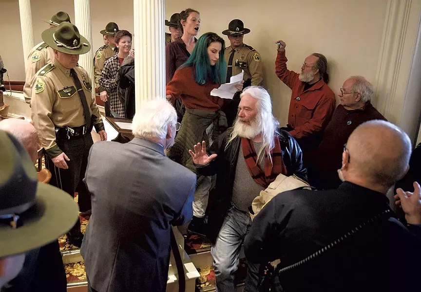Extinction Rebellion activists at Gov. Phil Scott's State of the State address - JEB WALLACE-BRODEUR