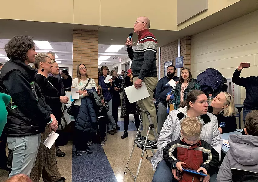 Rick Smith leads a caucus in Urbandale - PAUL HEINTZ