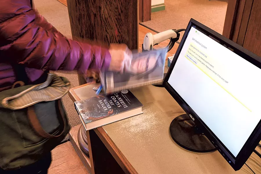 Self-checkout at Ilsley Public Library - CALEB KENNA