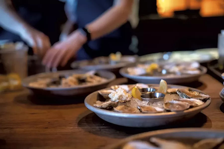 Preparing oysters at Hen of the Wood - LUKE AWTRY